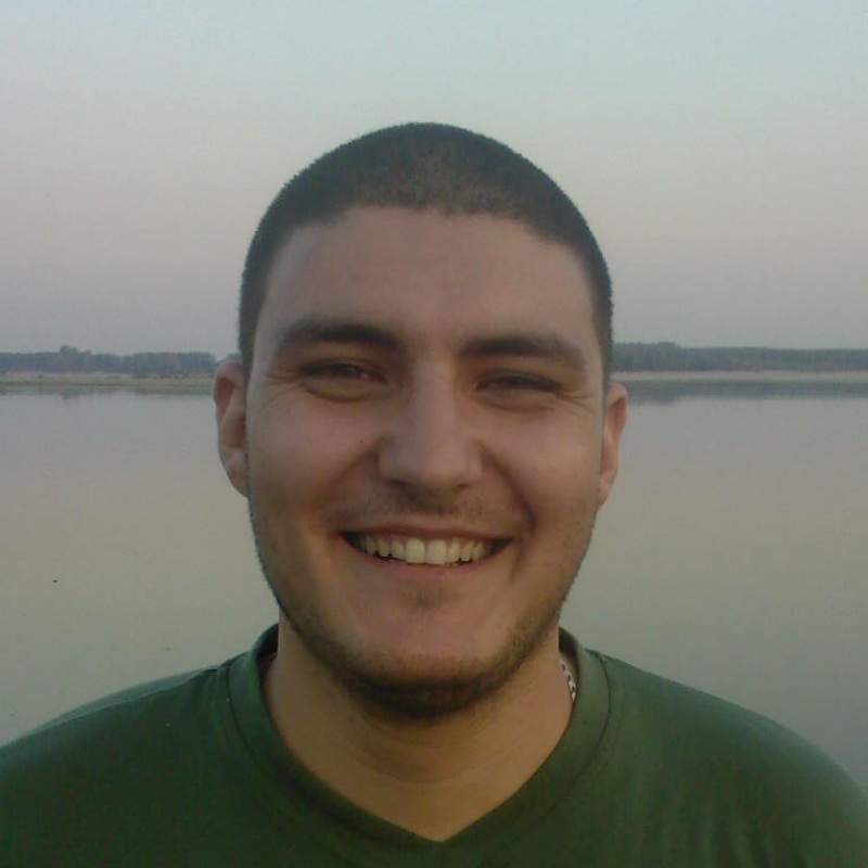 Mihai smiling outdoors in July 2008